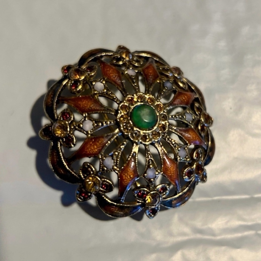 Vintage Monet ,Gold-Tone Floral Filigree Brooch with Orange and Green Accents